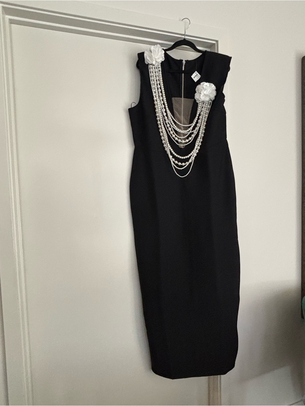 Elegant Black Midi Dress with Pearl Chain and Floral Accents